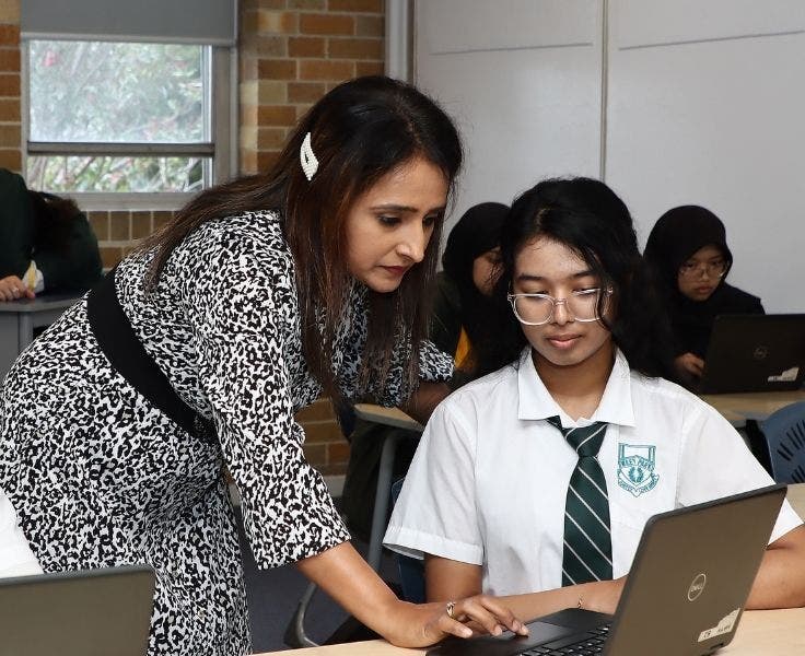 teacher and student with laptop