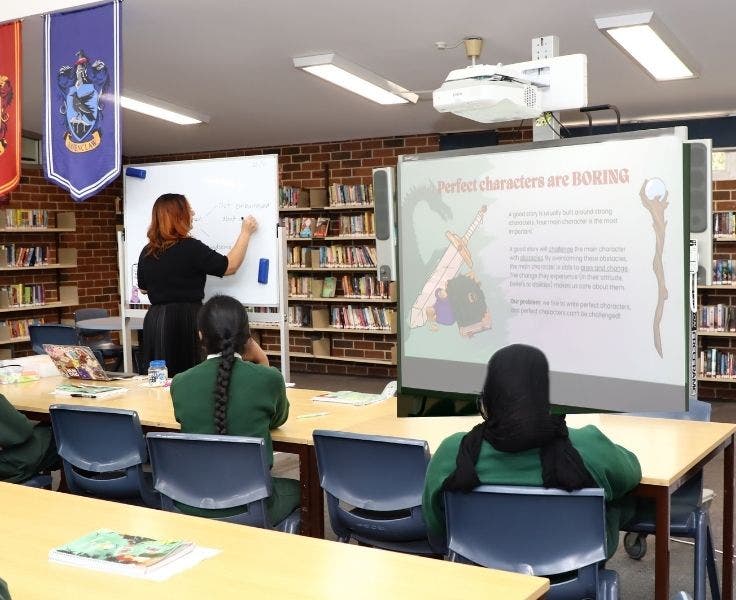 teacher with students in a classroom