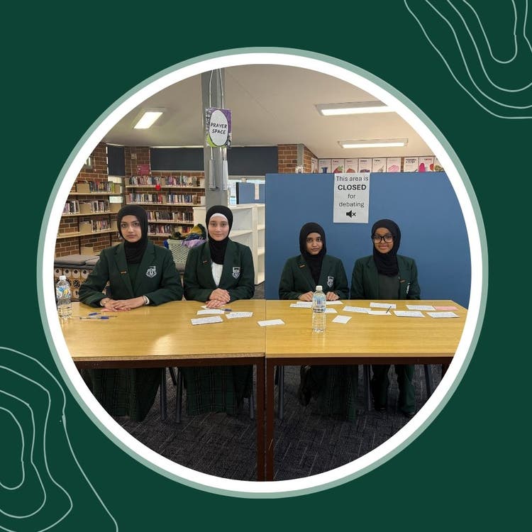 debating team sitting at desk